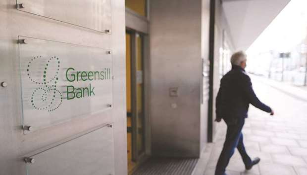 A visitor exits the building housing the Greensill Bank offices in Bremen, Germany. London-based Greensill group is preparing to file for insolvency and is in talks to sell parts of its business to US private equity firm Apollo Global Management Inc, sources close to the matter said.