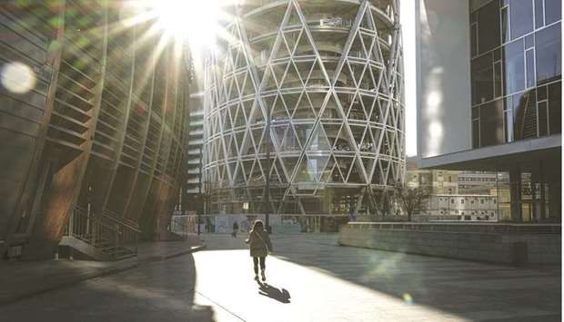 A lone pedestrian walks through the Porta Nuova business district in Milan. Surging ethical debt sales are helping to fuel the best-ever start to a year in Europeu2019s market for new bonds.