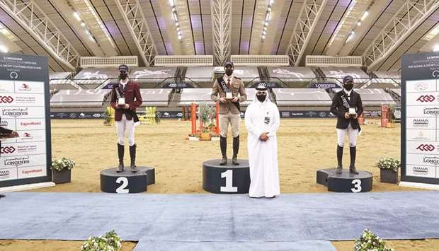 Director of Longines Hathab and Secretary General of the Qatar Equestrian Federation Ali bin Yousef al-Rumaihi (second right) poses with the Medium Tour podium finishers on Friday.