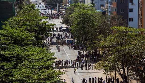 Protesters form lines as they take part in a demonstration against the military coup in Yangon
