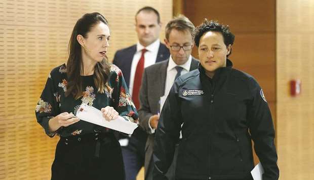 New Zealandu2019s Prime Minister Jacinda Ardern chats with Minister for Emergency Management Kiritapu Allan as they arrive for a planned press conference about Covid-19 restrictions, in Wellington yesterday, the morning after the country experienced a series of earthquakes and a tsunami warning along the coast.