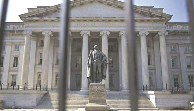 A statue of Albert Gallatin, former US Treasury secretary, stands outside the Treasury building in Washington, DC. The Federal Reserve looks poised to disappoint Wall Street by not extending an emergency exemption thatu2019s propped up the Treasury market since last yearu2019s pandemic panic.