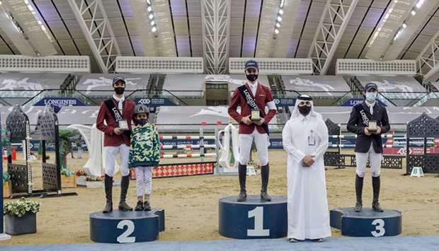Director of Longines Hathab and Secretary-General of the Qatar Equestrian Federation Ali bin Yousef al-Rumaihi (second right) poses with the Big Tour winner Nasser al-Ghazali (centre), runner-up Faris Saad al-Qahtani (left) and third-placed Kamil Sabitov at Al Shaqab