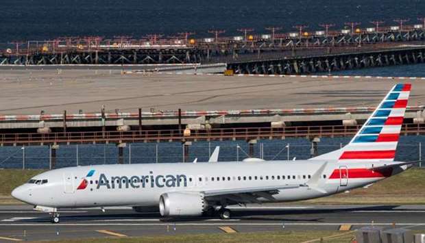 American Airlines flight 718, the first US Boeing 737 MAX commercial flight since regulators lifted a 20-month grounding in November, lands at LaGuardia airport in New York, US on December 29, 2020.