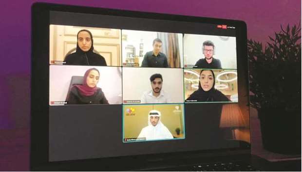 Members of the two teams present their arguments during the debate.