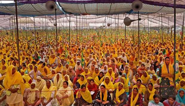 Women farmers attend a protest against farm laws on the occasion of International Women's Day at Bahadurgar