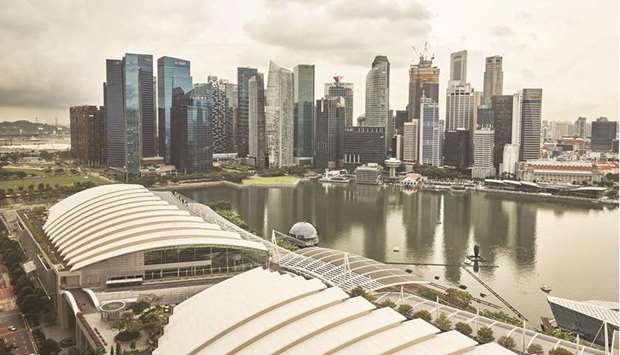 The central business district skyline from the Marina Bay Sands in Singapore. Stocks linked to Jardine Matheson Holdings, Singaporeu2019s biggest conglomerate by market value, rallied after saying it will delist the groupu2019s second-largest unit in a $5.5bn buyout to simplify its structure.