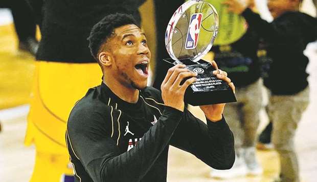 Team LeBron forward Giannis Antetokounmpo of the Milwaukee Bucks celebrates with the MVP trophy of the 2021 NBA All-Star Game at State Farm Arena in Atlanta, Georgia. (USA TODAY Sports)