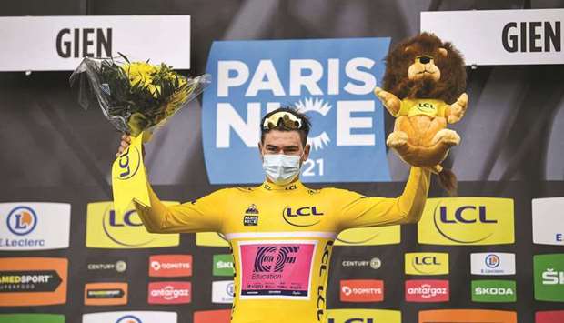 Team Education First rider Switzerlandu2019s Stefan Bissegger celebrates his overall leader yellow jersey on the podium after winning the 3rd stage of the 79th Paris-Nice cycling race, a 14.4-km individual time-trial from Gien to Gien yesterday. (AFP)