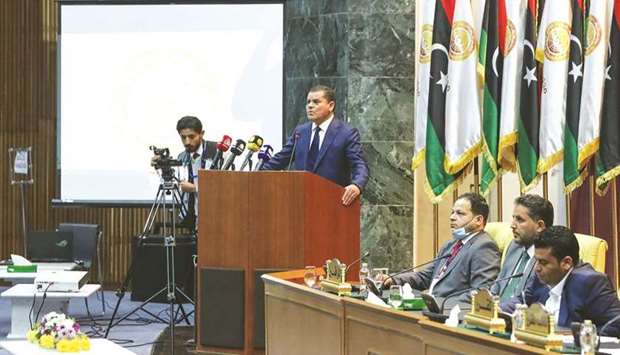 Libyau2019s prime minister-designate Abdul Hamid Dbeibah addresses lawmakers during the first reunited parliamentarian session, in the coastal city of Sirte east of the capital, yesterday.