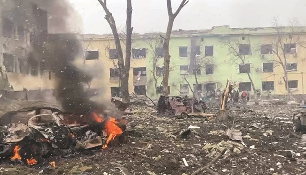 A view shows cars and a building of a hospital destroyed by an aviation strike in Mariupol, Ukraine, in this handout picture released yesterday. (Reuters)