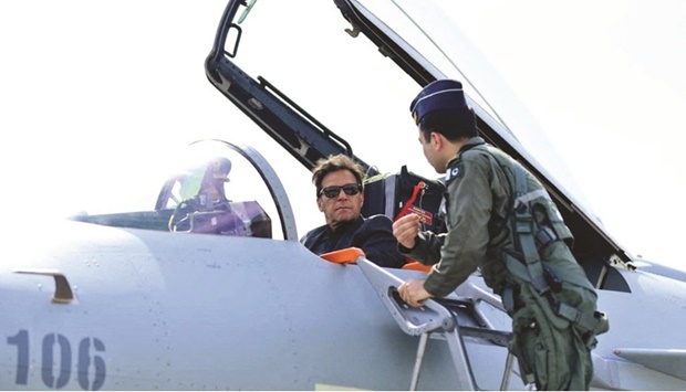 Prime Minister Imran Khan is seen in the cockpit of the Chinese J-10 C combat aircraft as he is briefed during the induction ceremony at the Pakistan Air Force (PAF) base in Kamra, Pakistan.
