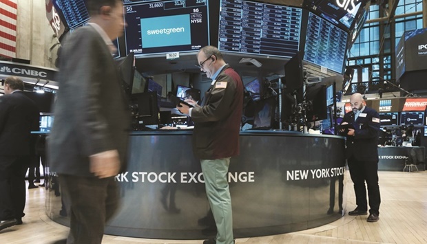 Traders work on the floor of the New York Stock Exchange. Investors are rushing to recalibrate their portfolios for a potentially extended period of elevated commodity prices, as Russiau2019s invasion of Ukraine sparks eye-popping moves in raw materials that threaten to exacerbate inflation and hurt growth.