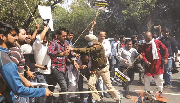 A policeman pushes demonstrators during a protest by Indian Youth Congress (IYC) members demanding immediate evacuation of Indian students from Ukraine, near the foreign ministeru2019s residence in New Delhi, India, yesterday.