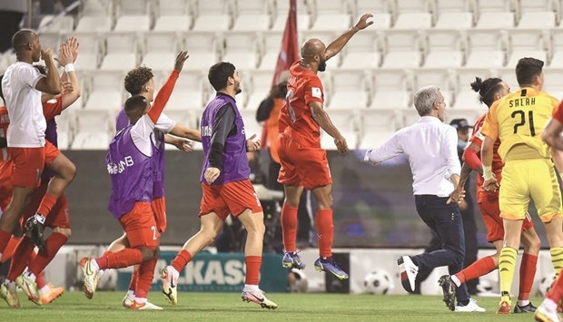 Al Duhail players and coach celebrate winning their Amir Cup semi-final against defending champions Al Sadd at the Jassim Bin Hamad Stadium in Doha on Monday. Al Duhail won 3-2. PICTURE: Noushad Thekkayil