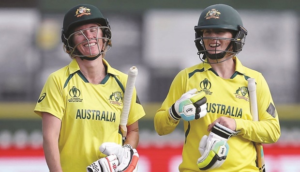 Australia's Rachael Haynes (right) with teammate Beth Mooney walk from the field after their win during the 2022 Women's Cricket World Cup match between the West Indies and Australia.