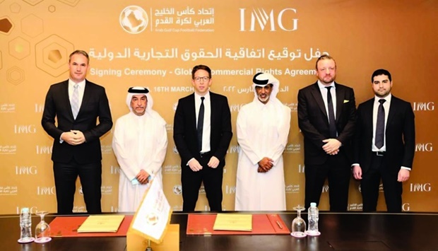 President of the Arab Gulf Cup Football Federation HE Sheikh Hamad Bin Khalifa Bin Ahmed al-Thani and Co-President, Media & Events at IMG Adam Kelly pose with other officials after the commercial partnership signing ceremony.