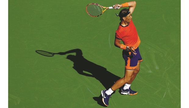 Rafael Nadal of Spain returns a shot to Nick Kyrgios of Australia during the quarter-final of the BNP Paribas Open at the Indian Wells Tennis Garden in Indian Wells, California. (AFP)