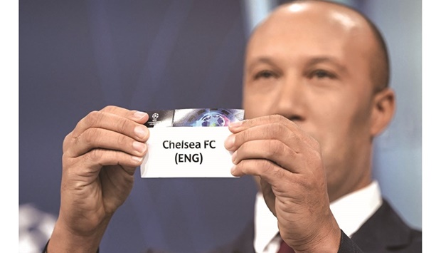 UEFA Champions League final ambassador and Former French footballer Mikael Silvestre holds the slip of Chelsea during the draw for the 2022 UEFA Champions League quarter-finals, semi-finals and final at the UEFA headquarters, in Nyon, yesterday. (AFP)