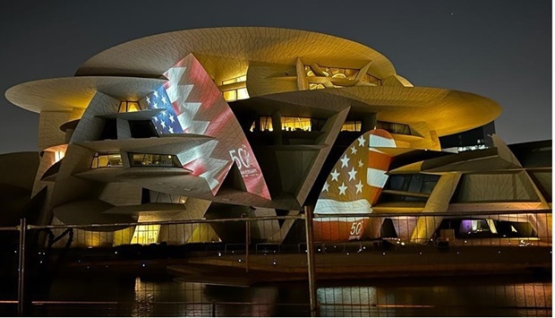  National Museum of Qatar lit up with the colours of the flags of Qatar and the US 