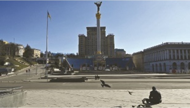 A lonely man sits at Kyivu2019s Independence Square, an iconic place for Ukrainians, on Monday. (AFP)