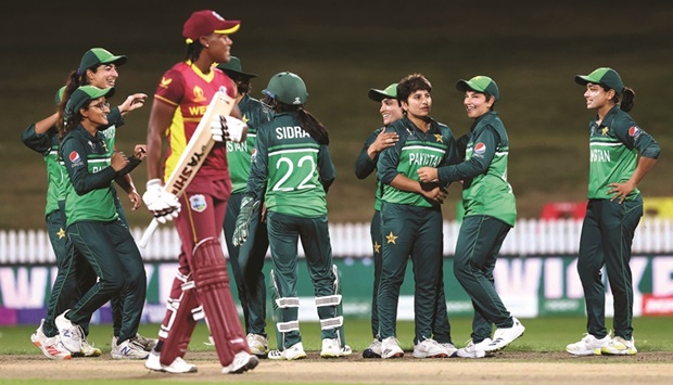 Pakistan players celebrate the wicket of West Indies Chinelle Henry during the 2022 Womenu2019s Cricket World Cup match at Seddon Park in Hamilton, New Zealand, yesterday. (AFP)