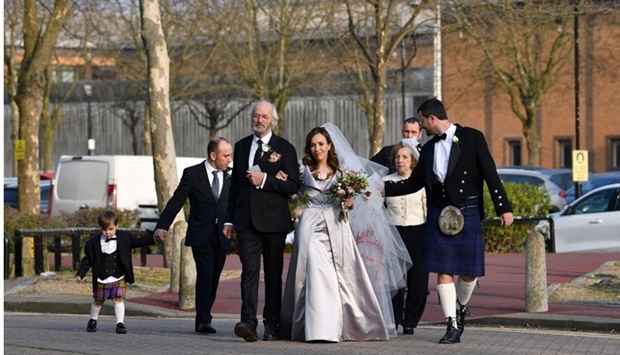 Richard Assange (3L), father of WikiLeaks founder Julian Assange, walks with his son's partner Stella Moris (C) as they leave from Belmarsh Prison in London, where Moris was set to marry Julian Assange. AFP