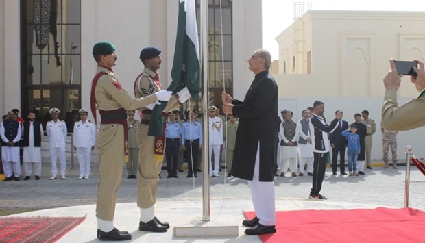 Ambassador Syed Ahsan Raza Shah hoisting the national flag.