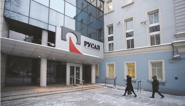 Employees enter the headquarters of United Co Rusal in Moscow. Rusal, the huge aluminium producer fighting blow-back from Russiau2019s war in Ukraine, is getting some help from traders in China to keep its smelters running.