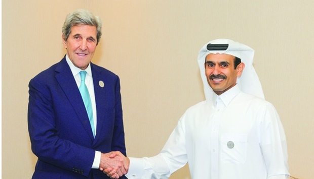 HE the Minister of State for Energy Affairs Saad bin Sherida al-Kaabi shaking hands with US Special Presidential Envoy for Climate John Kerry.