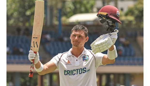 Joshua de Silva of West Indies walks off the field celebrating his first Test century during the third and final Test against England in Saint Georgeu2019s, Grenada, yesterday. (AFP)