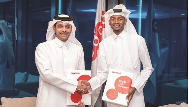 Deputy Group Chief Executive Officer and Chief Executive Officer of Ooredoo Qatar Sheikh Mohamed bin Abdulla al-Thani with Olympic and World high jump champion Mutaz Barshim.