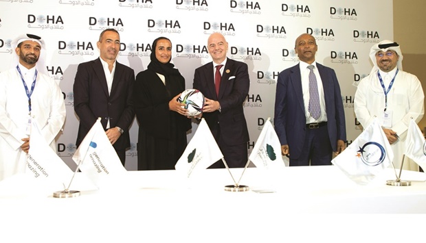 Vice-Chairperson and CEO of Qatar Foundation HE Sheikha Hind bint Hamad al-Thani, FIFA president Gianni Infantino and Secretary-General of the Supreme  Committee for Delivery & Legacy HE Hassan al-Thawadi with other dignitaries after the agreement signing ceremony.