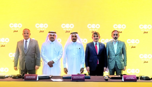 Qatar Chamber chairman Sheikh Khalifa bin Jassim al-Thani and Turkish ambassador Dr Mustafa Goksu joins other dignitaries after the signing ceremony.