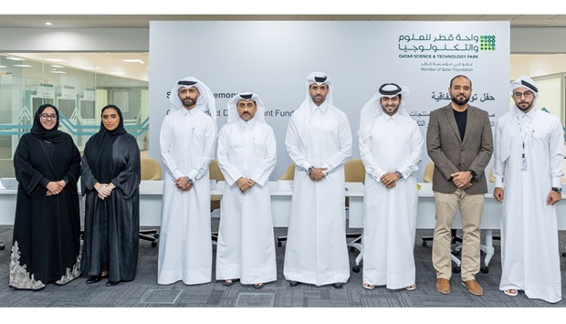 Recipients of QSTP's PDF programme during the signing ceremony.