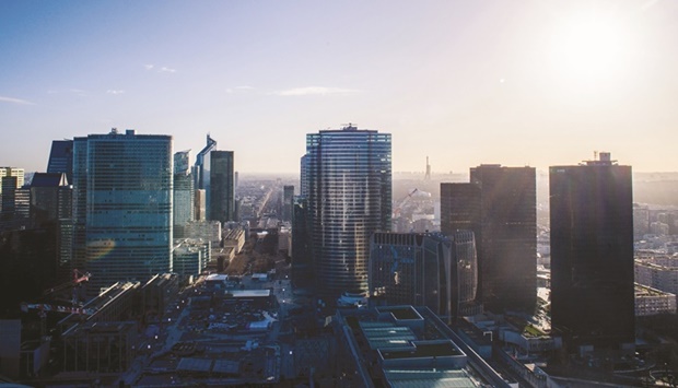 A view of the La Defense financial district from the rooftop of the Grande Arche in Paris. Buyout activity is picking up pace in Europe, but a number of banks are taking a cautious approach to new risk, looking for higher pricing, more flex protection and in some instances fuller fees on junk-rated debt underwrites against a backdrop of heightened volatility, inflation and rising rates.