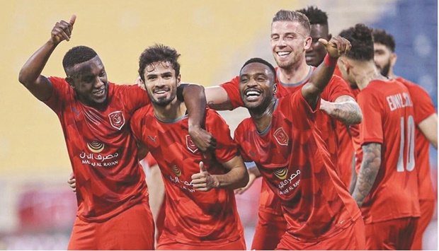 Al Duhail players celebrate their win over Umm Salal in the penultimate round of the QNB Stars League at the Al Gharafa Stadium yesterday.