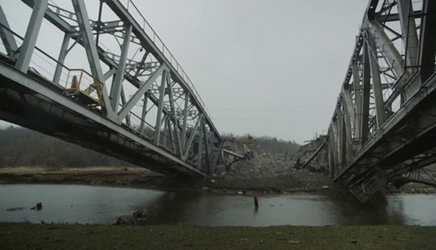 A view of a destroyed bridge, amid Russia's invasion of Ukraine, in Irpin, Ukraine on March 29 in this still image taken from video obtained by Reuters/via REUTERS