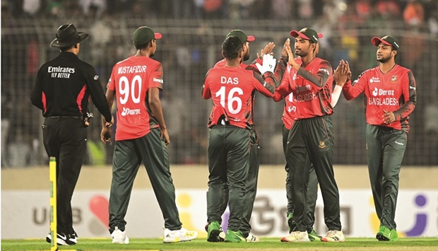 Bangladeshu2019s players celebrate after winning the first Twenty20 international against Afghanistan in Dhaka yesterday. (AFP)