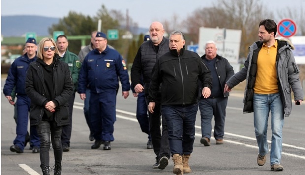 Hungarian Prime Minister Viktor Orban visits the Ukraine-Hungary border where people cross into the country to flee the Russian massive military operation against Ukraine, in Beregsurany, Hungary on February 26. REUTERS