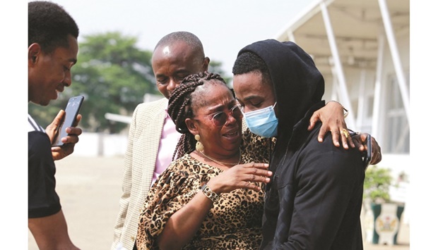 A mother reacts after seeing her son, one of the Nigerian students who arrived from Ukraine after fleeing Russian invasion, in Abuja, yesterday.