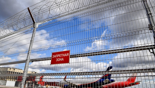 In this file photo taken on April 04, 2020 an Aeroflot plane is seen behind a fence at Moscow's Sheremetyevo airport.
