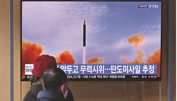 People watch a television screen showing a news broadcast with file footage of a North Korean missile test, at a railway station in Seoul yesterday after North Korea fired at least one u201cunidentified projectileu201d in the countryu2019s ninth suspected weapons test this year according to the Southu2019s military.