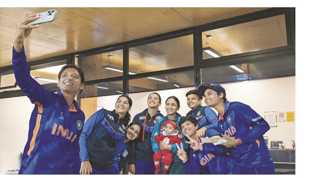 Indian players gather around Pakistan captain Bismah Maroof and her daughter Fatima for a selfie in Mount Maunganui, New Zealand, yesterday. Earlier yesterday India beat Pakistan in their ICC Womenu2019s World Cup clash by 107 runs at the same venue.