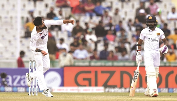 Indiau2019s Ravindra Jadeja bowls during the third day of the first Test against Sri Lanka in Mohali yesterday. (AFP)