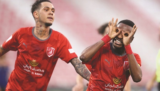 Al Duhailu2019s Ismail Mohamed (right) celebrates after scoring against Al Sailiya in the Amir Cup quarter-finals on Sunday.