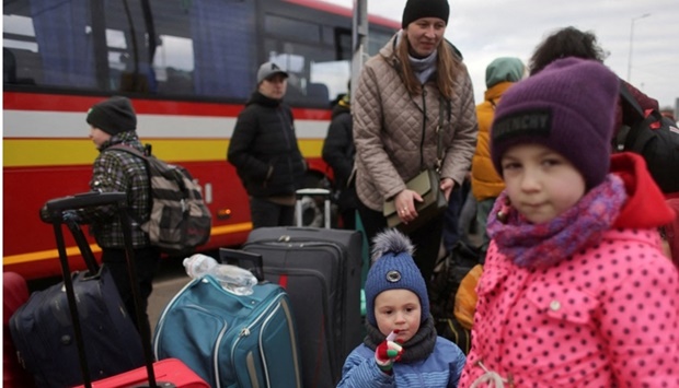 People fleeing the Russian invasion of Ukraine wait for transport after arriving in Slovakia, at a border crossing in Vysne Nemecke, Slovakia on March 5. REUTERS