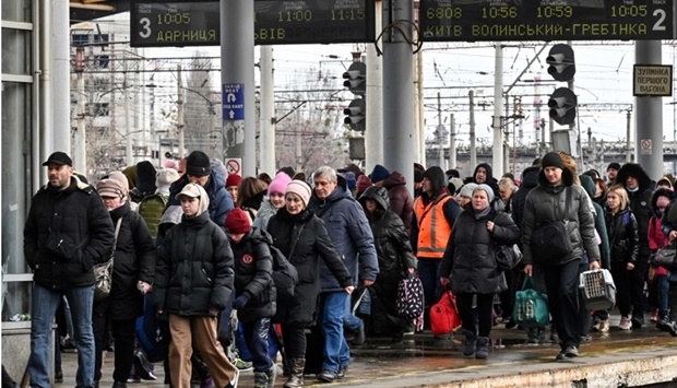 People try to get an evacuation train at Kyiv train station on March 5. Genya Savilov /AFP