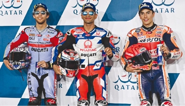 From left: Second-placed Gresini Racingu2019s Enea Bastianini, pole-sitter Pramac Ducatiu2019s Jorge Martin and third-placed Hondau2019s Marc Marquez pose on the podium following the qualifying session for the MotoGP Grand Prix of Qatar at the Losail International Circuit on Saturday. Photo by: Noushad Thekkayil