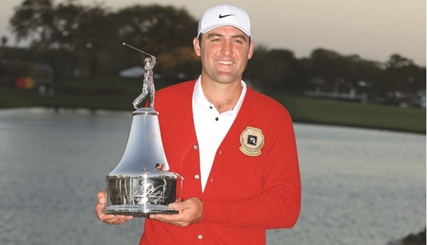Scottie Scheffler of the US poses with the trophy after winning the Arnold Palmer Invitational at Arnold Palmer Bay Hill Golf Course in Orlando, Florida. (AFP)